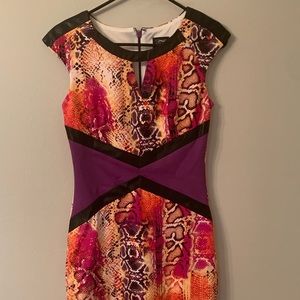 Fun and flirty reptile print body hugging dress
